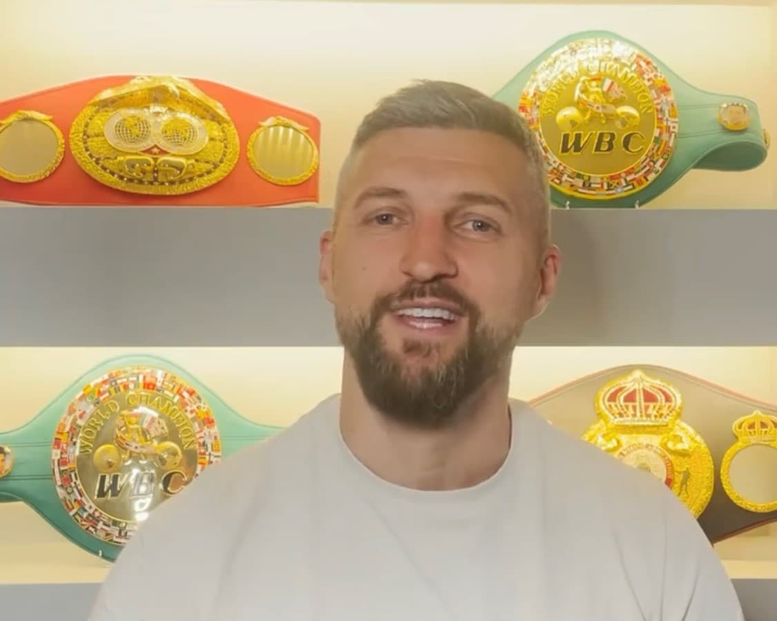 Carl Froch With Belts in Home