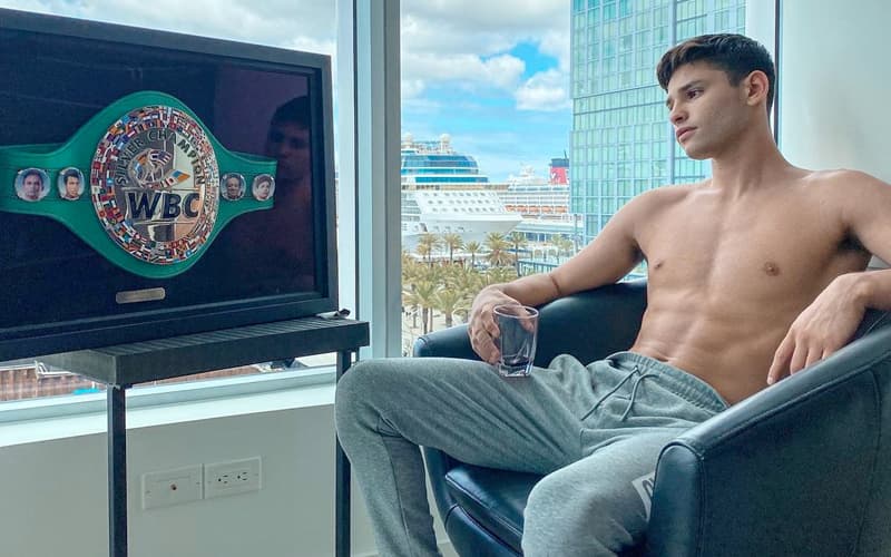 Ryan Garcia Looking at Framed WBC Belt