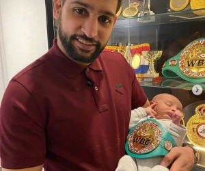 Amir Khan presents baby world champion in WBC belt